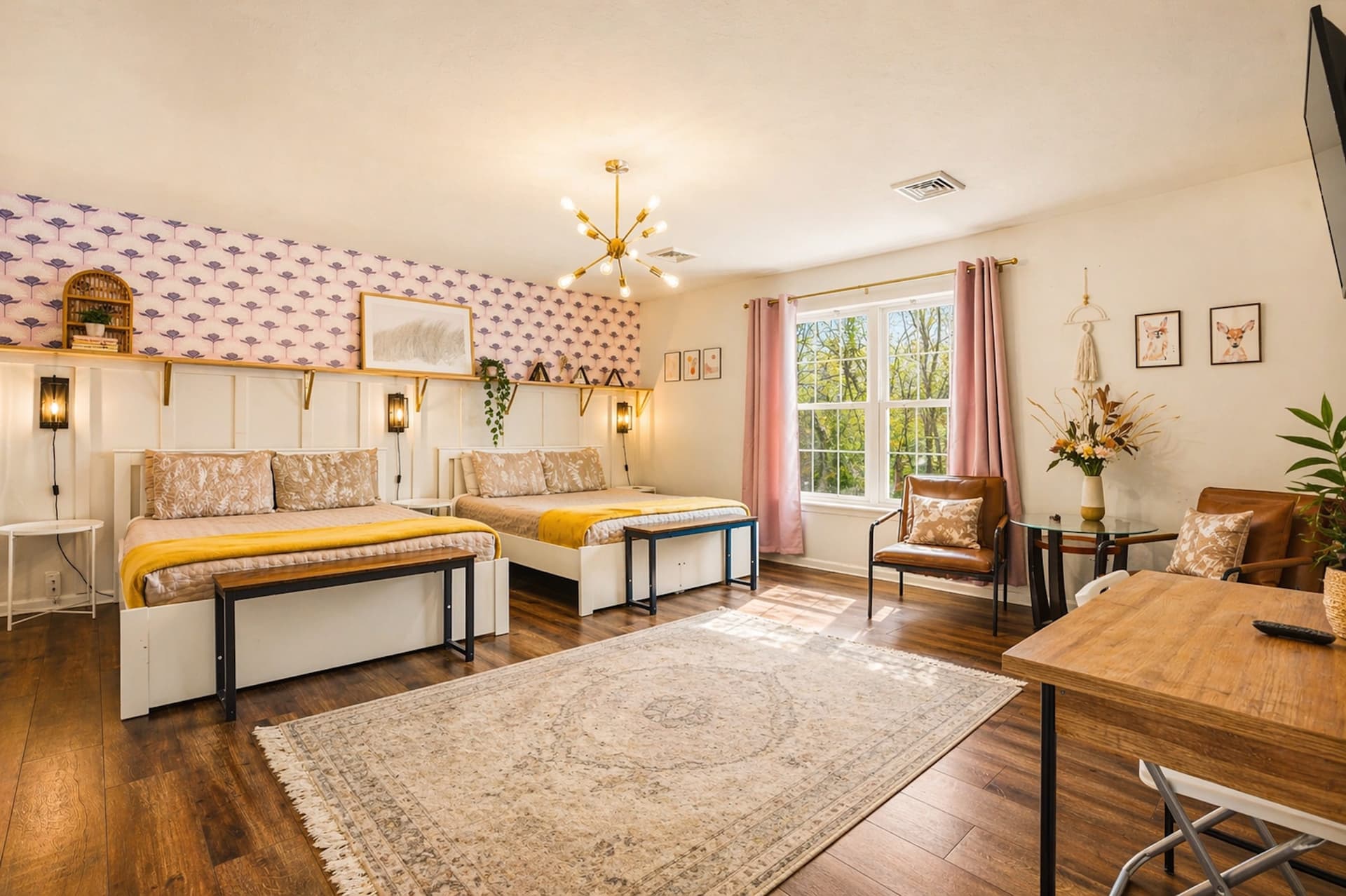 Bedroom with two beds and a sitting area