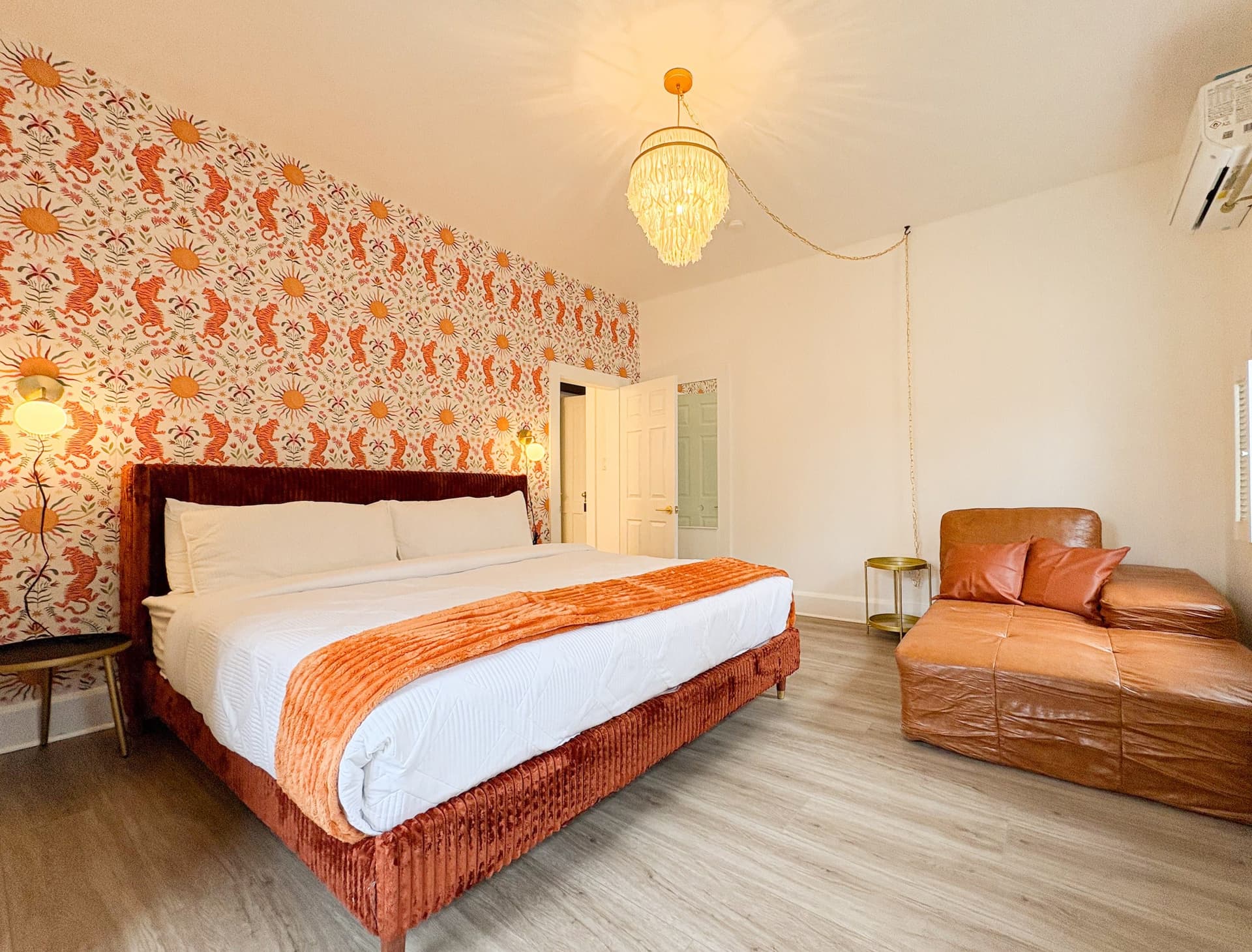 Bedroom 1 with a king bed and a leather chaise