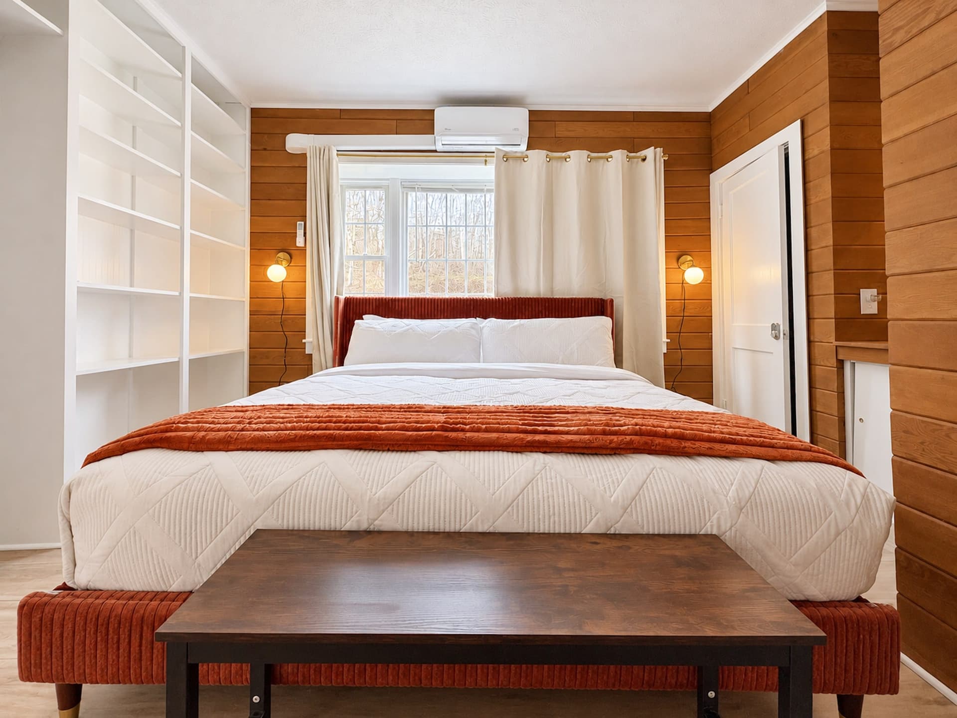 Bedroom 5 with a king bed and built-in shelves